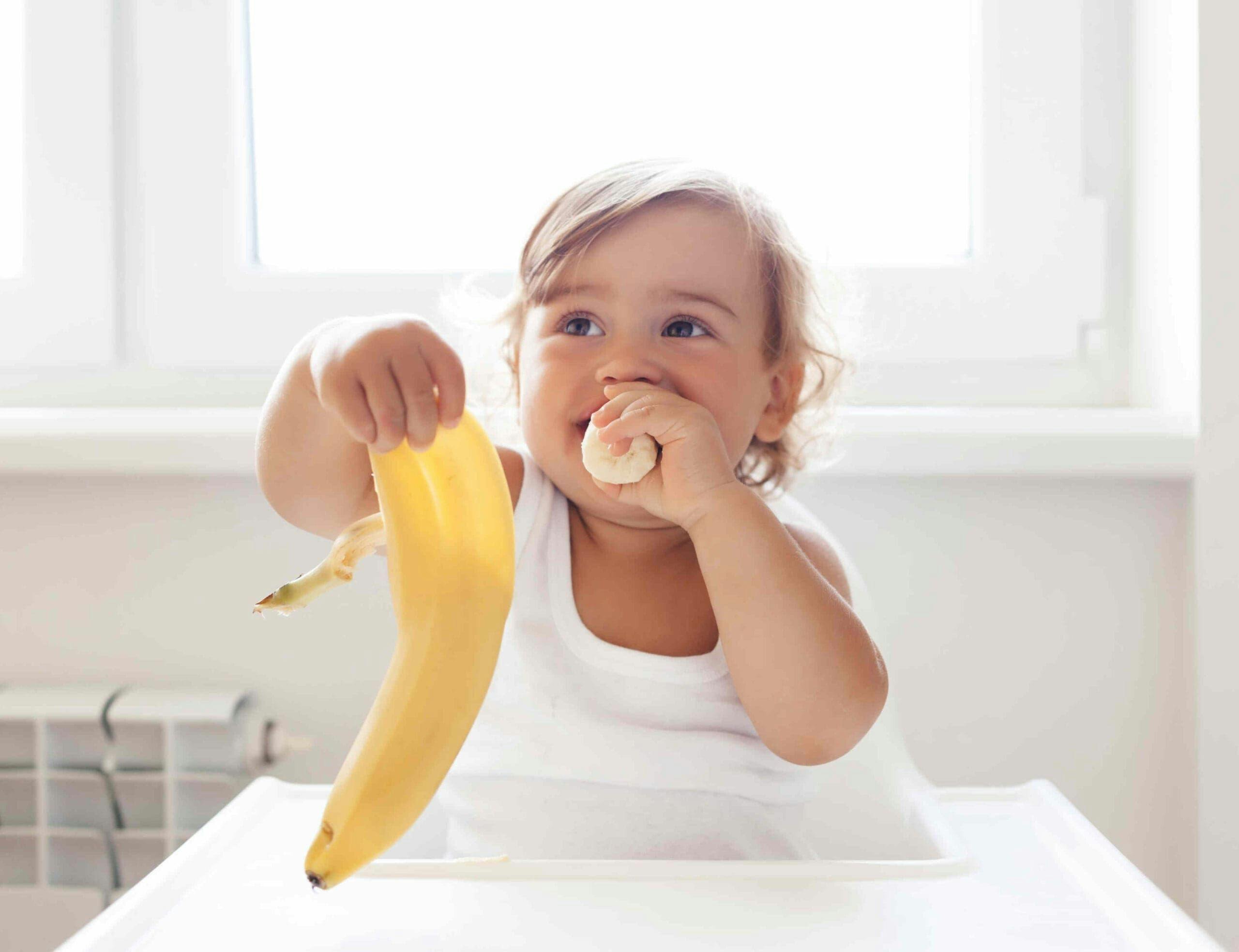 Baby Eating Banana Scaled Min